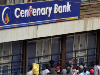 People queueing to use an ATM outside a bank