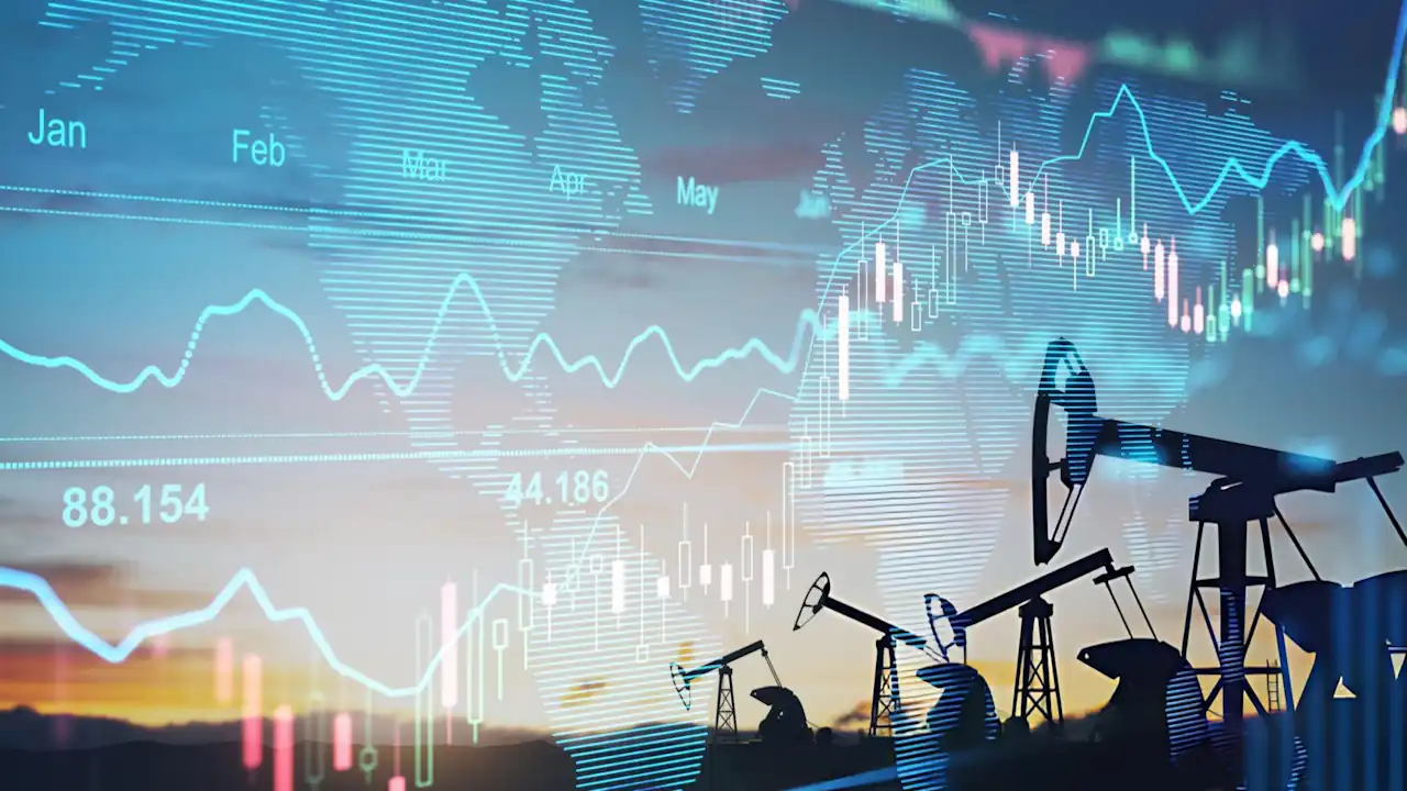 Rise in gasoline prices concept with double exposure of digital screen with financial chart graphs and oil pumps on a field. Stock photo.