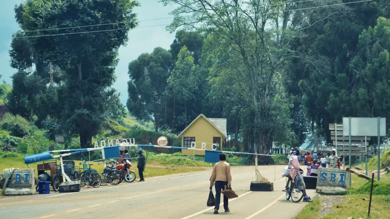 People crossing the border from the Democratic Republic of the Congo into Bunagana, in the south-west of Uganda.