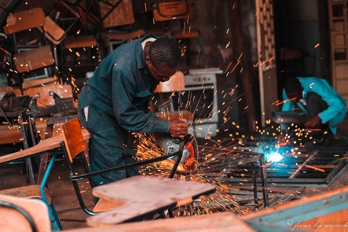 Men operating welding machinery