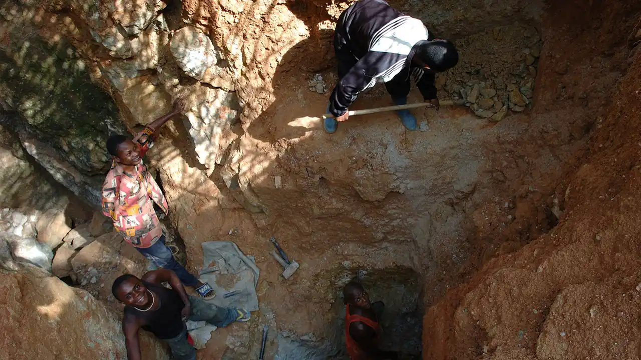 Four men working in an open-pit mine in the Democratic Republic of Congo