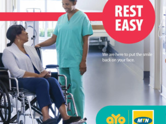 A female nurse talks to a woman in a wheelchair